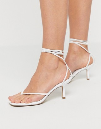 toe post heeled sandals uk