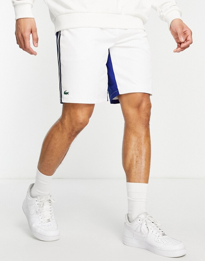 Lacoste Sport shorts with blue paneling in white - ShopStyle