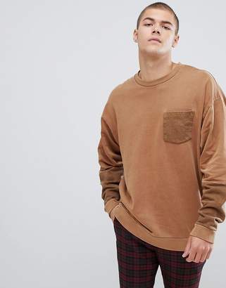 ASOS Design DESIGN oversized crew in washed yellow