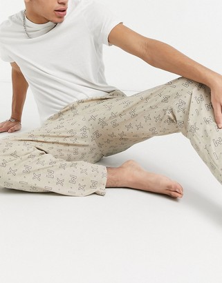 ASOS DESIGN lounge trousers with roman numeral print