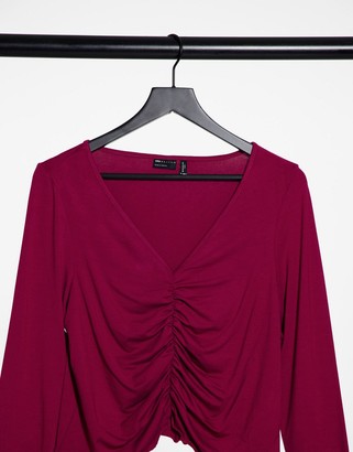 ASOS Curve DESIGN Curve V-front ruched detail top with long sleeves and lettuce edge in burgundy