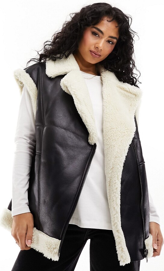 ASOS DESIGN borg faux fur gilet in black with contrast borg detail