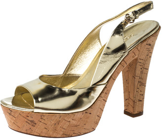 black and gold peep toe heels