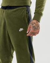 Thumbnail for your product : Nike Borg Joggers With Side Stripe In Green 929126-395