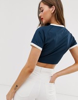 Thumbnail for your product : Ellesse recycled ringer crop top with front logo