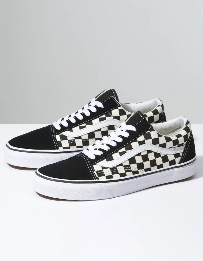 black and white vans with yellow stripe