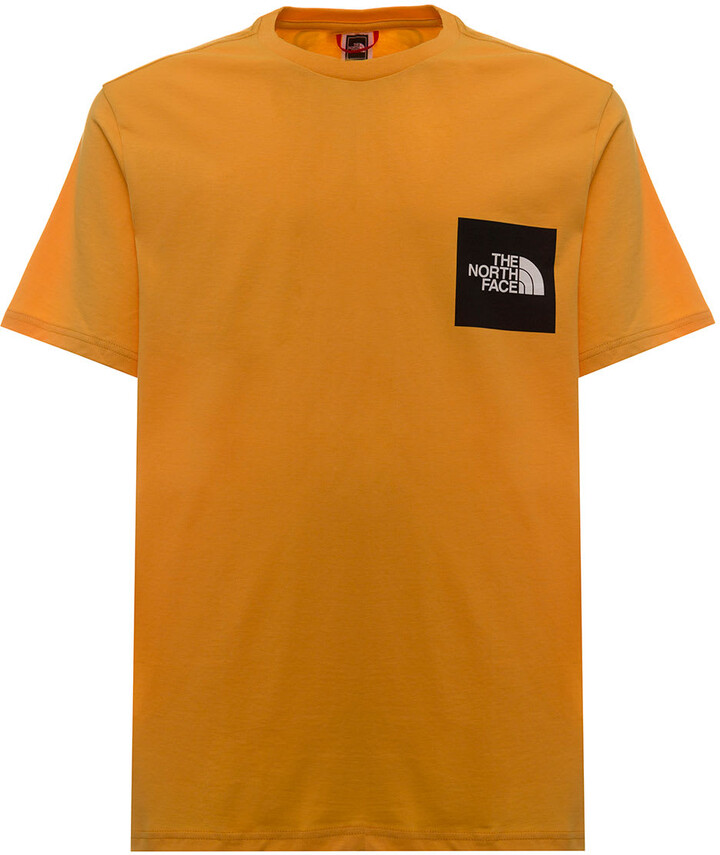 orange north face shirt