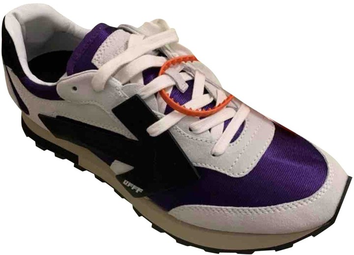 white and purple trainers