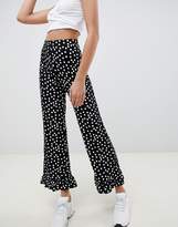 Thumbnail for your product : ASOS Tall DESIGN Tall trousers with fluted ruffle hem in spot print