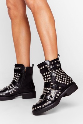 black boots with studs around sole