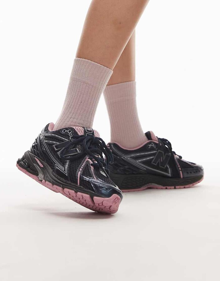 New Balance 1906r sneakers in black and pink