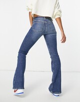 Thumbnail for your product : Topshop low rise flare jeans in mid blue