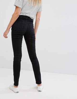 ASOS Maternity DESIGN Maternity Ridley high waisted skinny jeans in clean black with under the bump waistband