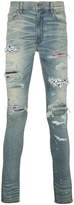 Thumbnail for your product : Amiri art patch printed jeans