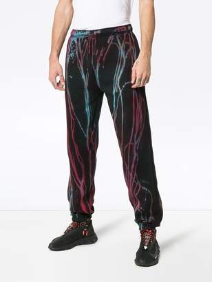 Stain Shade red and blue paint print sweatpants