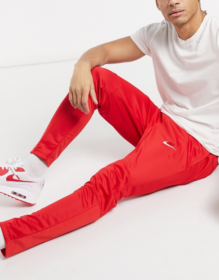 nike red swoosh joggers
