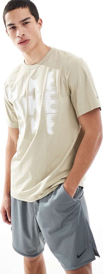 Nike Training blurred swoosh graphic t-shirt in beige
