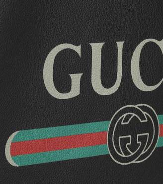 Gucci Printed leather drawstring backpack