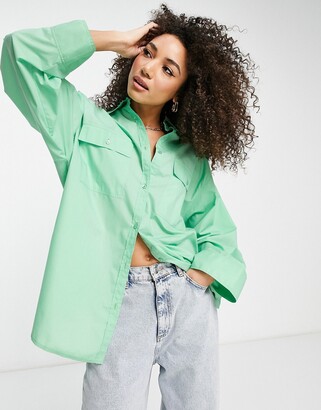 ASOS DESIGN oversized shirt with wide cuff detail in green - ShopStyle Tops