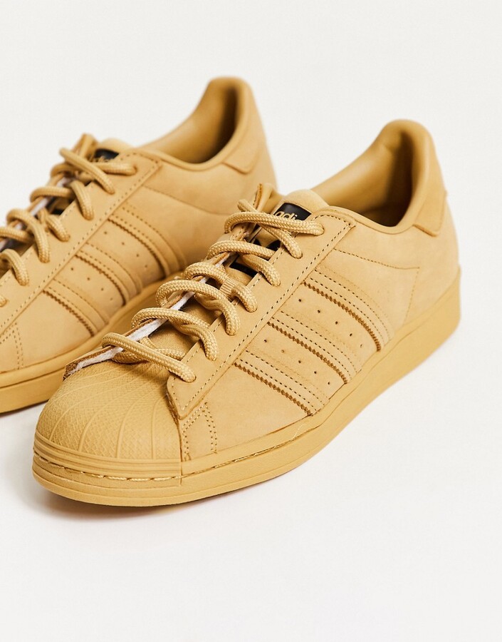 adidas Superstar sneakers in golden beige - ShopStyle
