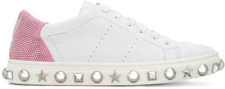 white sneakers with gold studs
