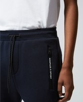 Thumbnail for your product : The Kooples Slim blue joggers with zipped pockets & badge