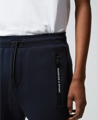 The Kooples Slim blue joggers with zipped pockets & badge