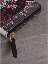 Thumbnail for your product : Burberry Doodle Print Coated Check Canvas Ziparound Wallet