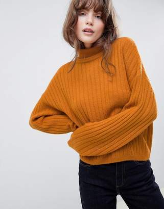 ASOS DESIGN fluffy sweater in rib with roll neck