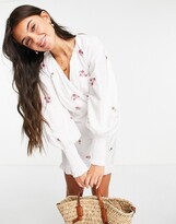 Thumbnail for your product : ASOS DESIGN cotton poplin wrap front mini dress with all over embroidery in white