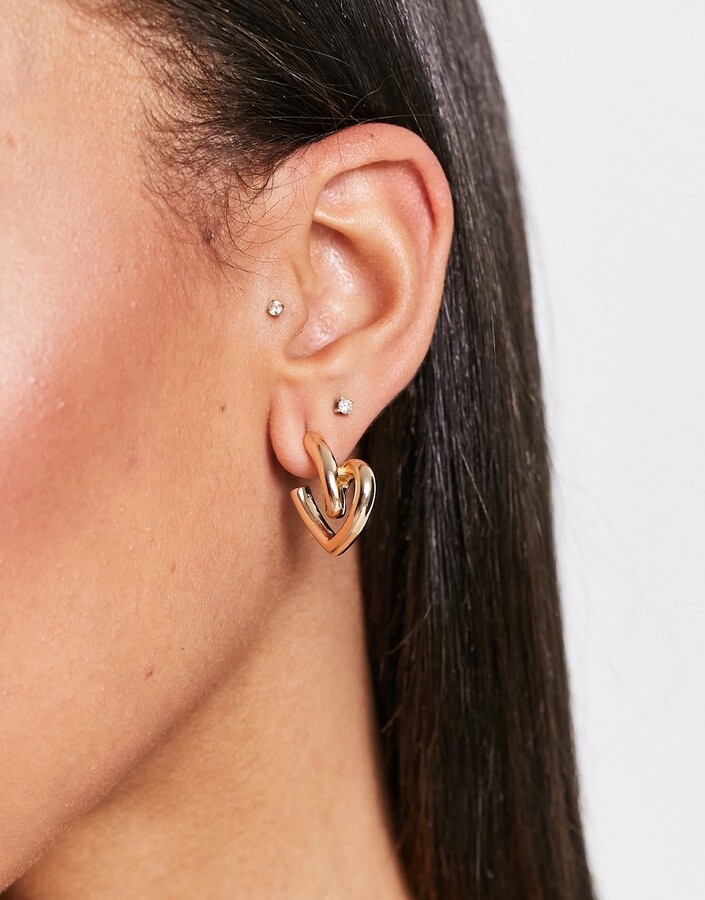 Monki twisted heart earrings in gold ShopStyle
