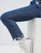 Thumbnail for your product : Tommy Jeans High Rise Slim Izzy Jeans With Distressed Hem