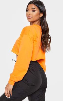 PrettyLittleThing Hot Orange Cut Off Crop Longsleeve Sweater