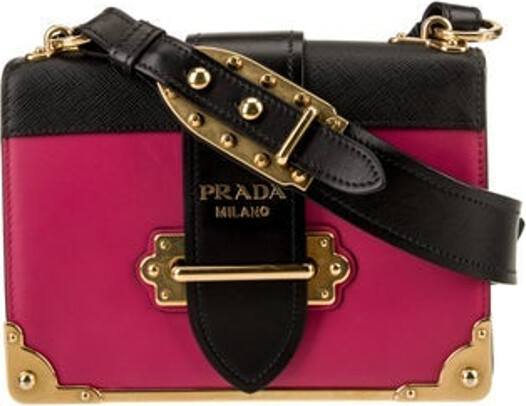 Prada Crossbody Bag By Miuccia Pink City Calf Leather Colorblock Pattern Antiqued Gold-Tone Hardware Saffiano Leather Trim Single Adjustable Shoulder Strap Leather & Studded Accents Leather Lining & Dual Interior Pockets Flap & Pull-Through Closures at Front Unfortunately, due to restrictions, this item may not be eligible for shipping in all areas.