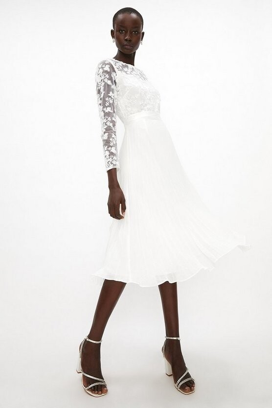 white dress with pleated skirt