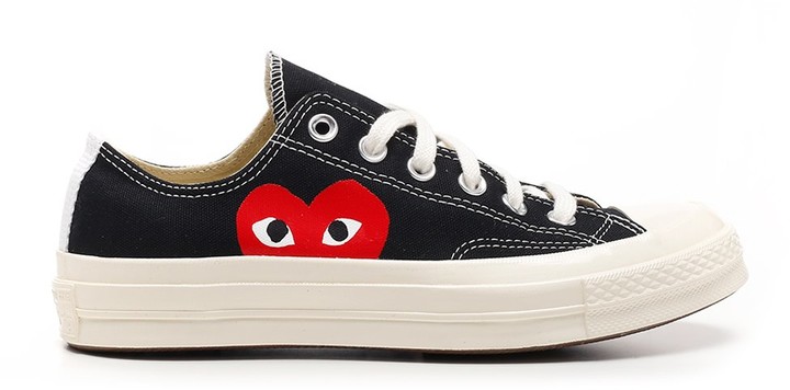 converse with the heart on them