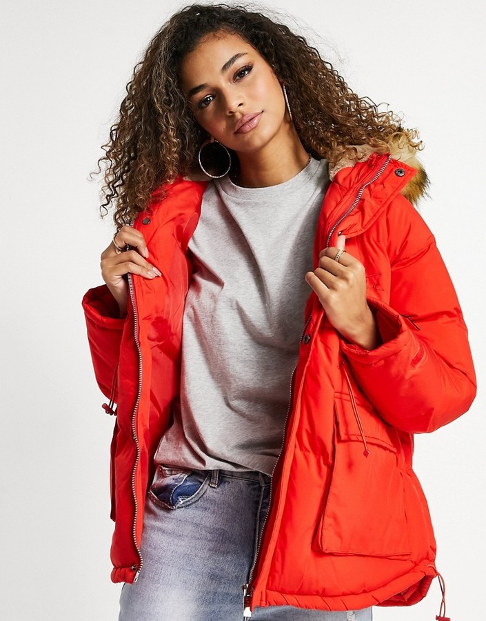 red coat with fur trim hood