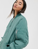 Thumbnail for your product : Monki longline bomber jacket in green
