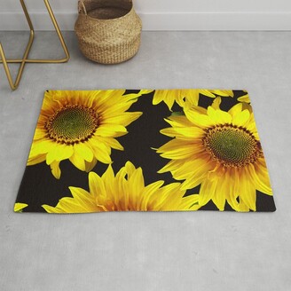 https://img.shopstyle-cdn.com/sim/14/ef/14ef0243acbb35f7b602eac149e940b4_xlarge/large-sunflowers-on-a-black-background-decor-society6-buyart-rug.jpg