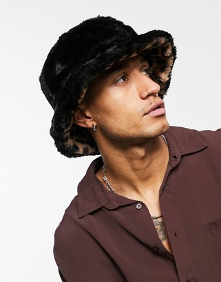 ASOS DESIGN reversible trapper hat with pink print in black