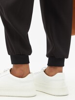 Thumbnail for your product : Chloé Drawstring-waist Pegged Satin-back Crepe Trousers - Black