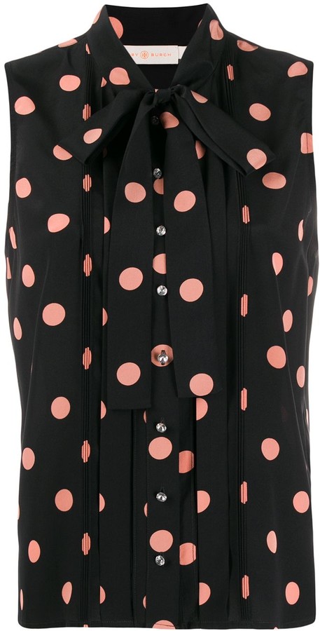 red blouse with black polka dots