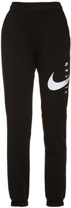 nike swoosh cuffed woven sweatpants in khaki