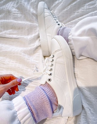 white trainers with silver back