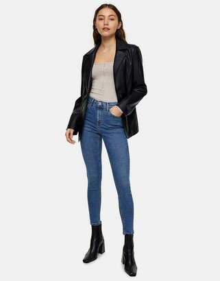 Topshop Jamie jeans with abraded hem detailing in mid blue
