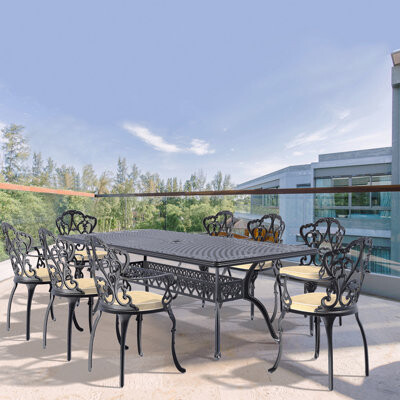 Astoria Grand 9-Piece Set Of Cast Aluminum Patio Furniture With Black Frame And Off-White Seat Cushions