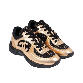 chanel trainers black and gold
