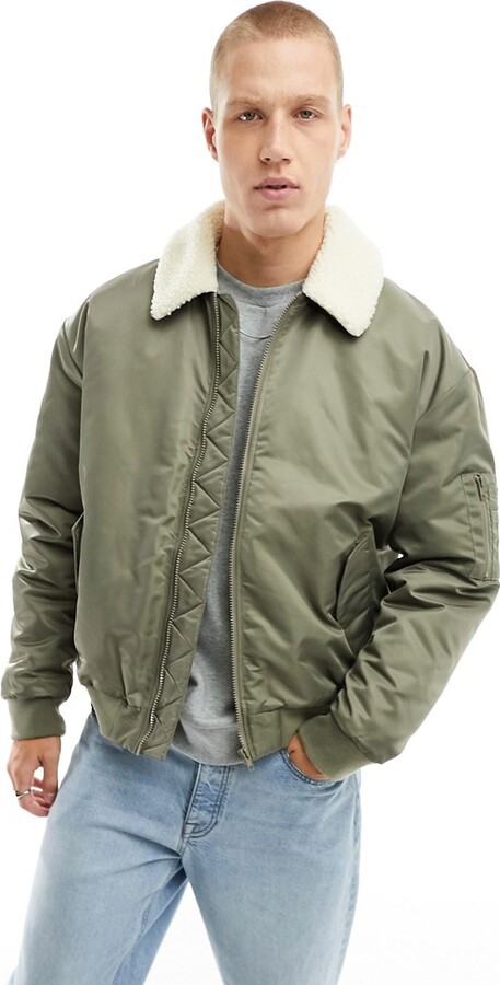 ASOS DESIGN oversized varsity bomber jacket in green and ecru cotton