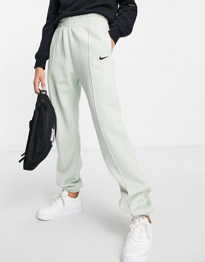 Nike Fleece loose-fit cuffed sweatpants in dusty green - ShopStyle Activewear Pants