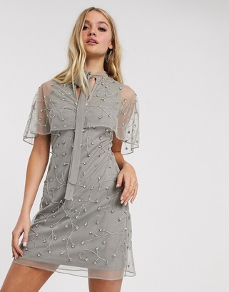 frock and frill cape dress